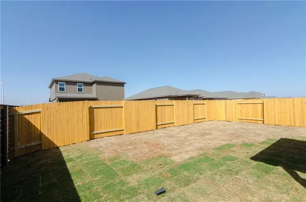 a view of empty room with a large window