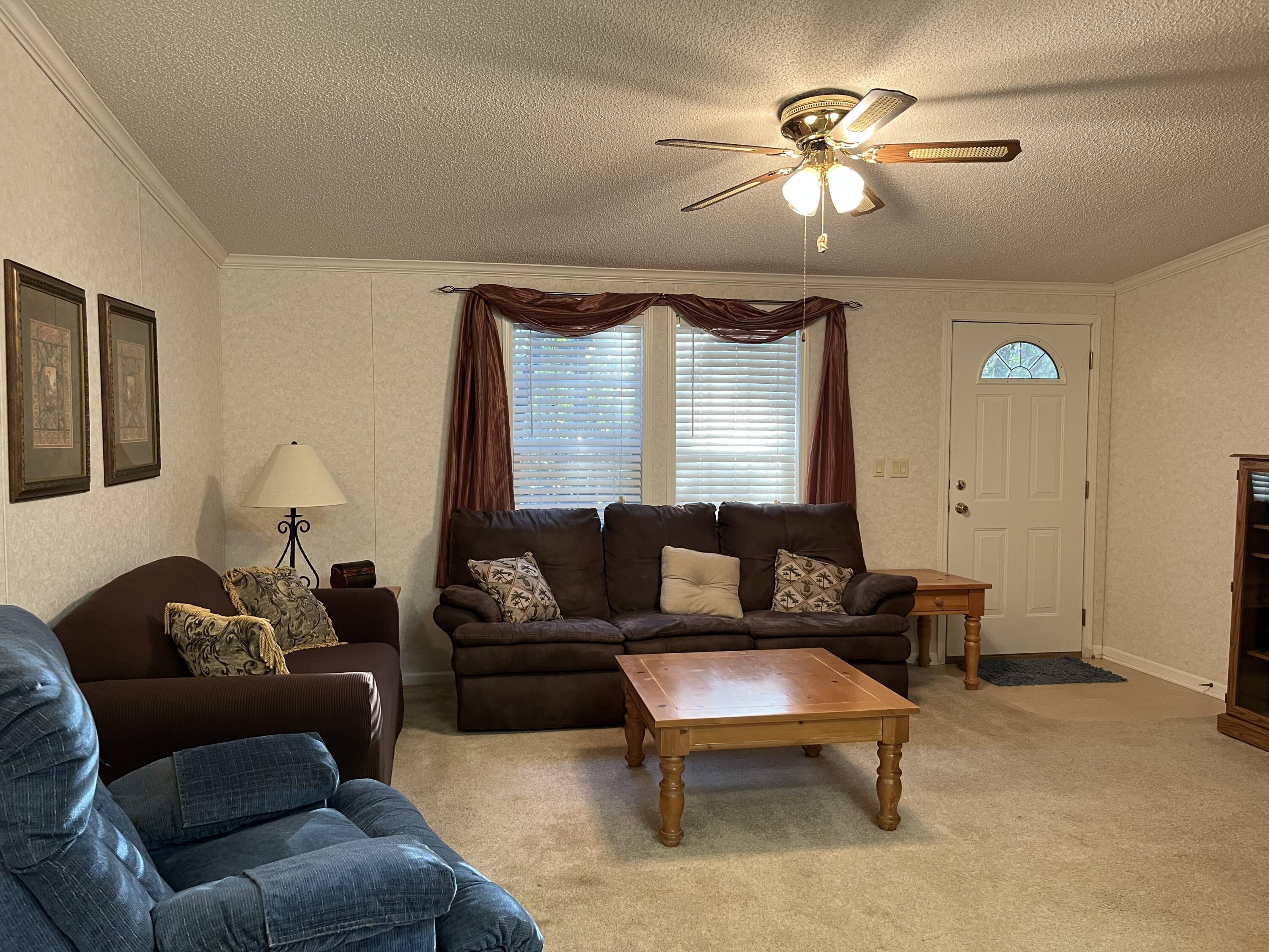 1104 Cat Island Road DeFuniak Springs, FL 32433 - Photo 14 of 28 a living room with furniture and a large window