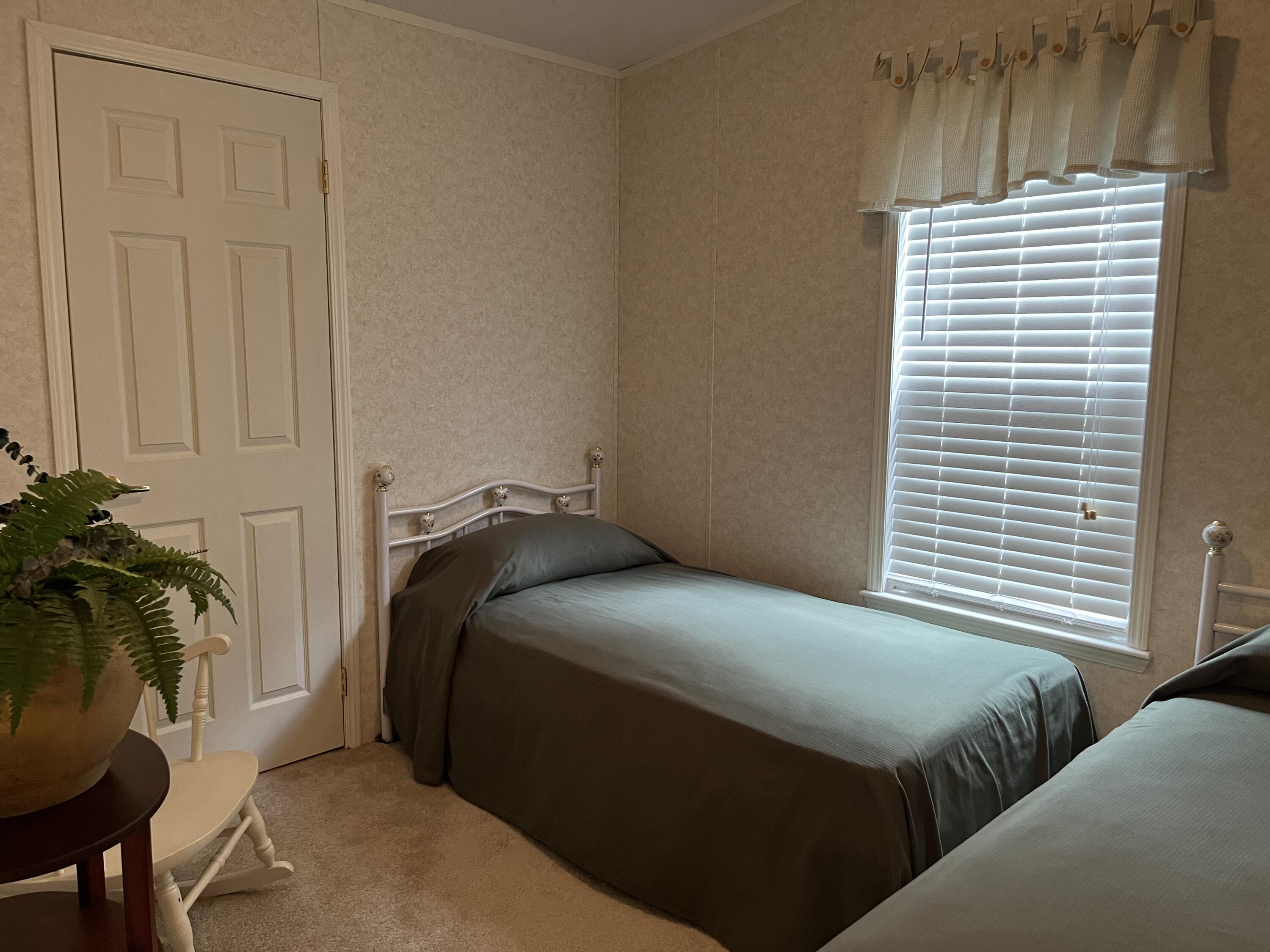 1104 Cat Island Road DeFuniak Springs, FL 32433 - Photo 20 of 28 a bedroom with a bed and a window