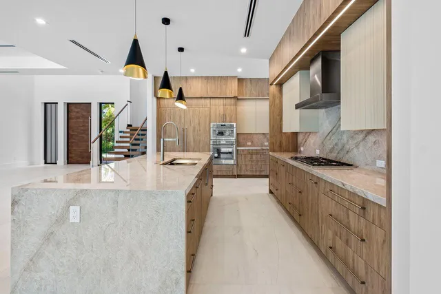 a spacious bedroom with a bed and a flat screen tv