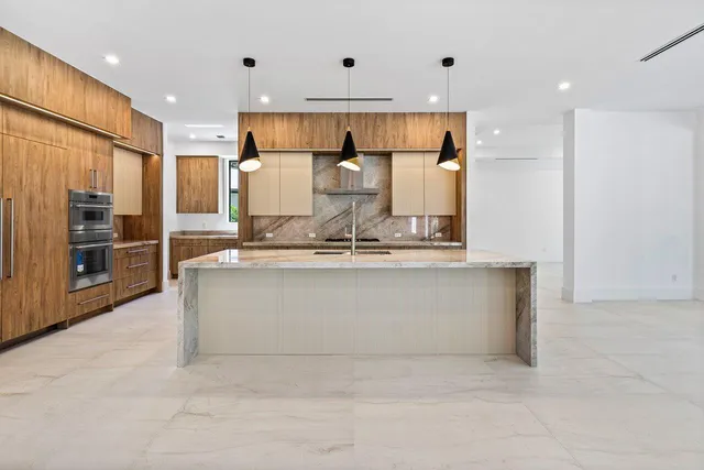 a bedroom with a large bed and a large window