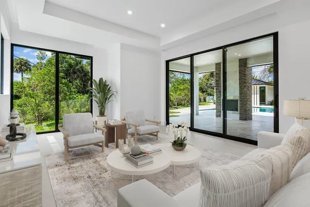 an empty room with wooden floor and sliding door