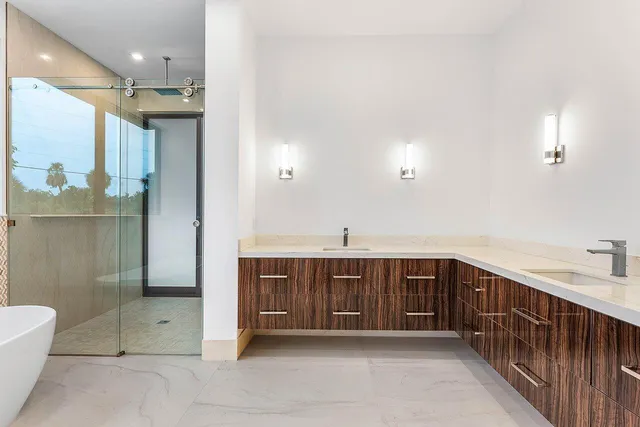 a view of a kitchen with a sink and a fireplace
