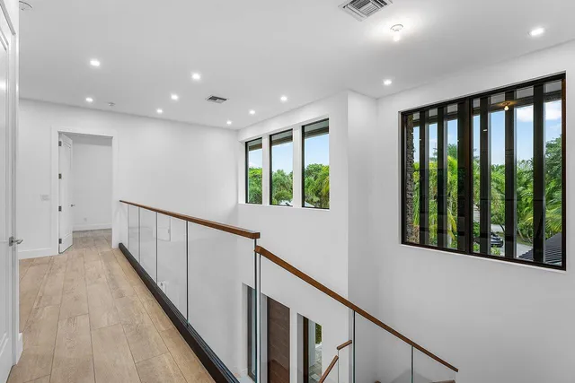 an aerial view of residential house with outdoor space and swimming pool