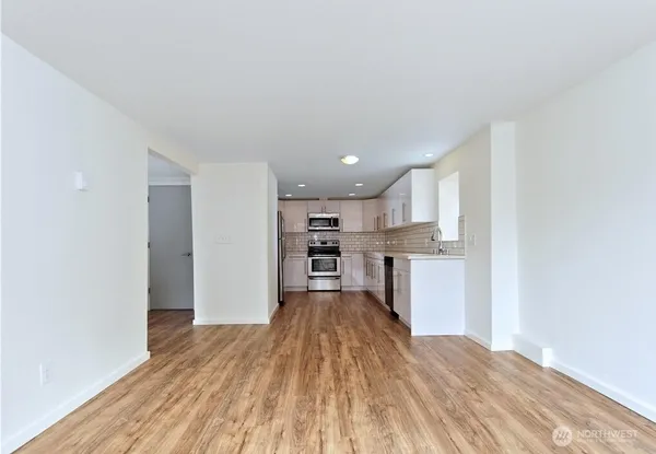 a view of kitchen with wooden floor