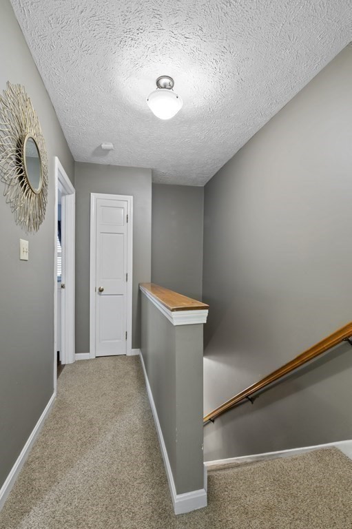 9 Sudbury Street, Unit 9 Maynard, MA 01754 - Photo 12 of 35 a view of a hallway with closet