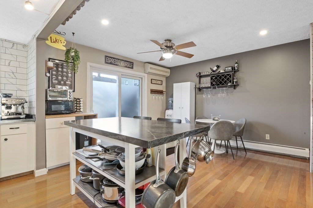 9 Sudbury Street, Unit 9 Maynard, MA 01754 - Photo 8 of 35 a very nice looking dining room with a large window and stainless steel appliances