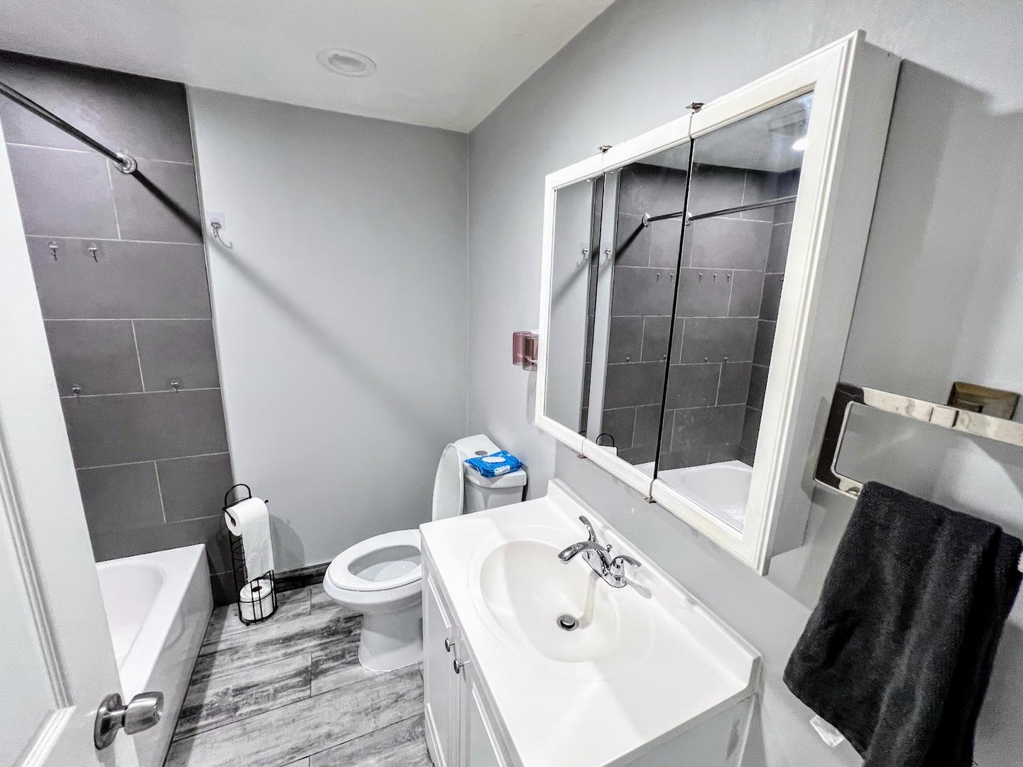3335 North Kenneth Avenue, Unit G Chicago, IL 60641 - Photo 10 of 13 a bathroom with a sink toilet and shower