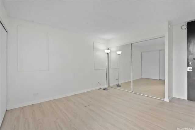 a view of an empty room with glass door