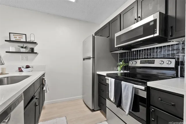 a kitchen with a stove and a microwave