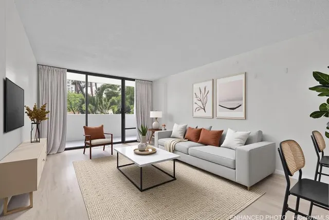 a living room with furniture and a flat screen tv