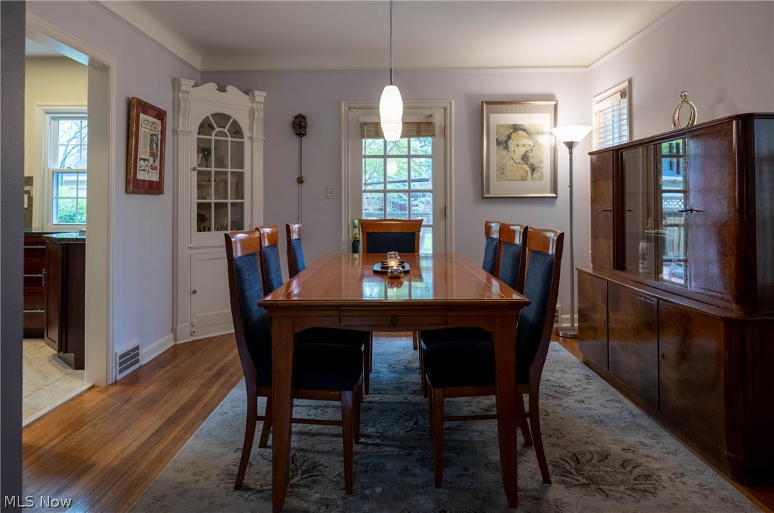 3433 Bradford Road Cleveland, OH 44118 - Photo 9 of 35 This warm & inviting Din rm allows to be formal or informal. Classic built in China cabinet for your treasures is accented by the cove ceilings & beautiful Hrd Wd flrs. The dr ahead, w/ newer storm dr (2017) leads to a covered brick patio & courtyard.