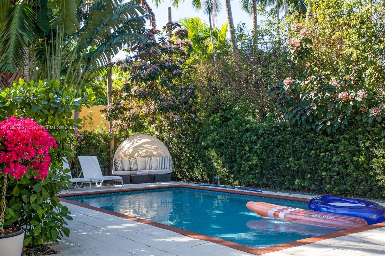 3020 Alton Road Miami Beach, FL 33140 - Photo 22 of 29 a view of swimming pool with sitting area