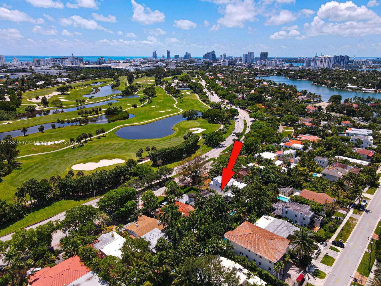 3020 Alton Road Miami Beach, FL 33140 - Photo 27 of 29 an aerial view of residential houses with outdoor space and trees
