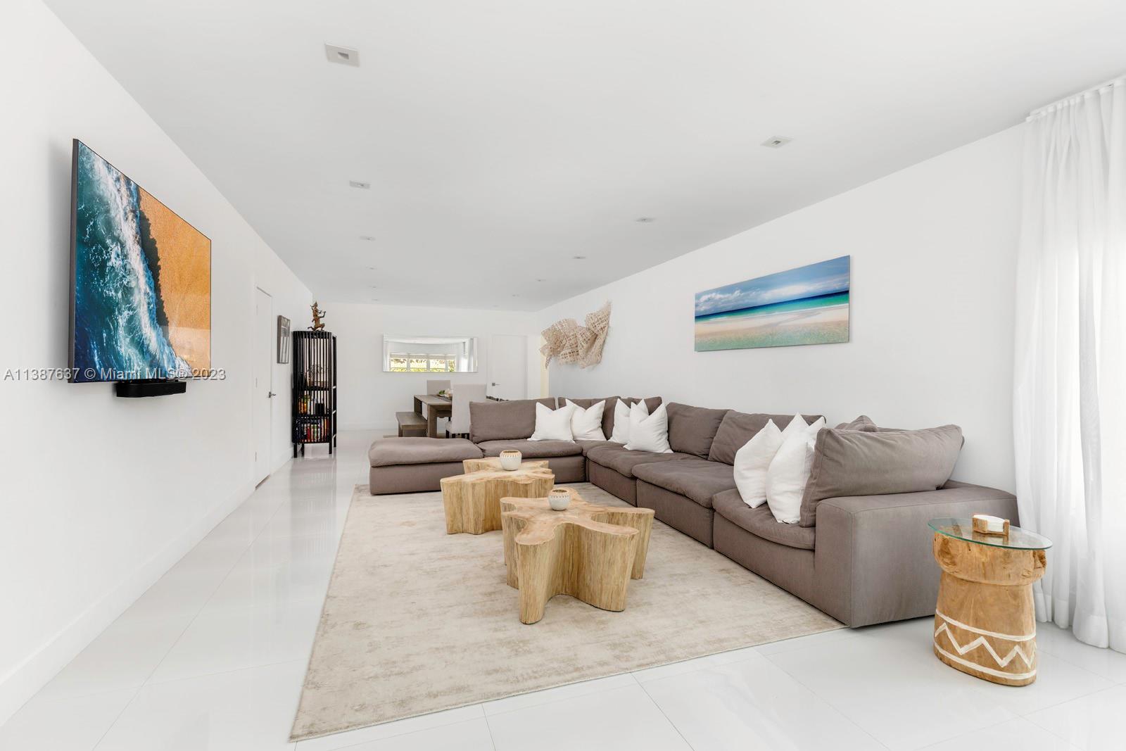 3020 Alton Road Miami Beach, FL 33140 - Photo 9 of 29 a living room with furniture and a couch