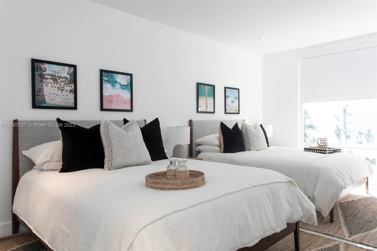 3020 Alton Road Miami Beach, FL 33140 - Photo 10 of 29 a large bedroom with bed and window