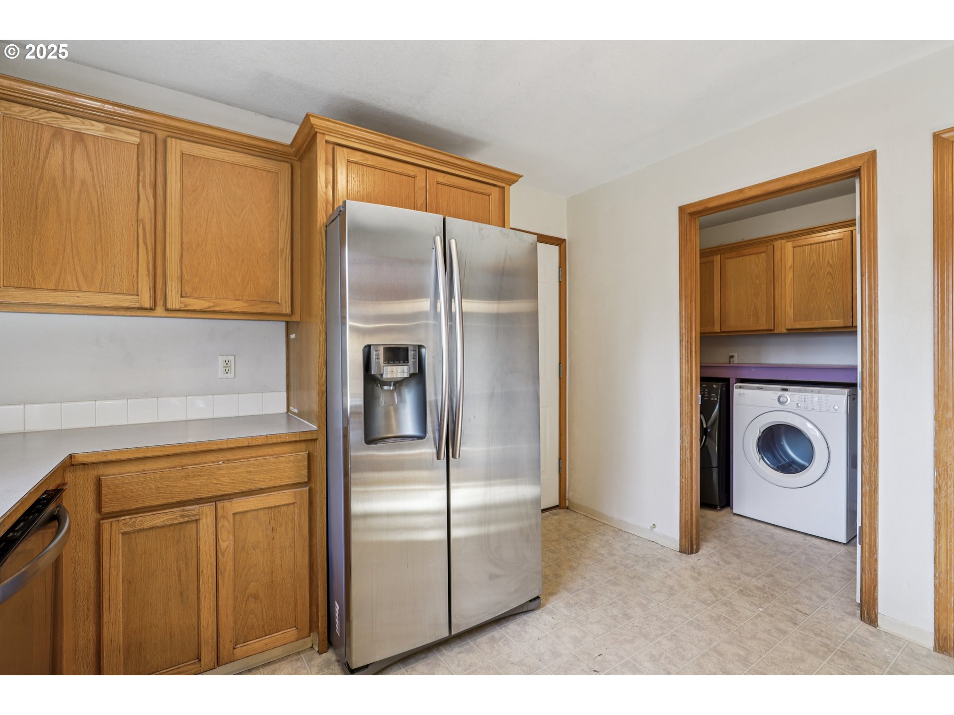 52866 Northeast 2nd Street Scappoose, OR 97056 - Photo 11 of 33 a kitchen with refrigerator a washer and dryer