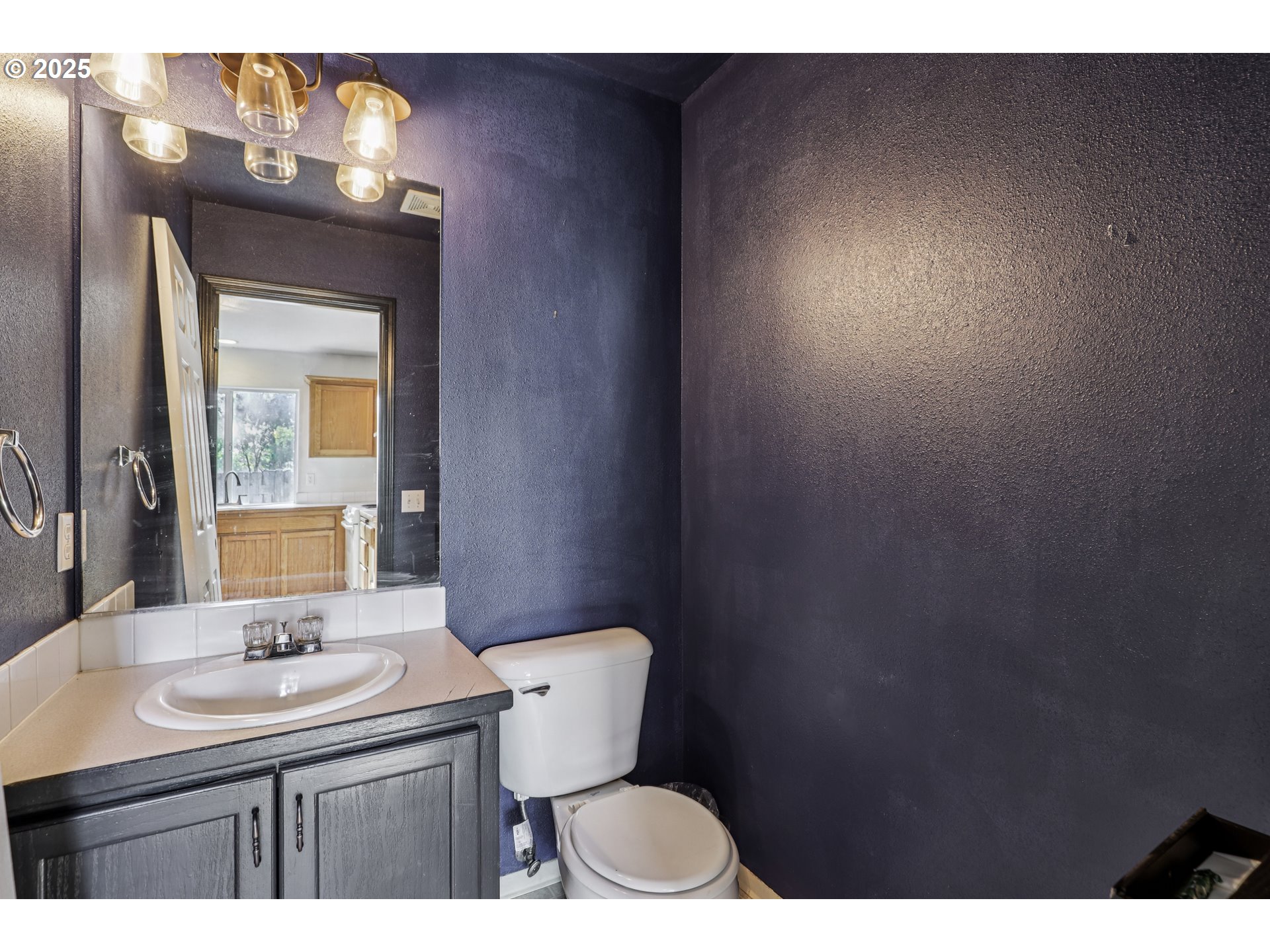 52866 Northeast 2nd Street Scappoose, OR 97056 - Photo 13 of 33 a bathroom with a toilet sink and mirror