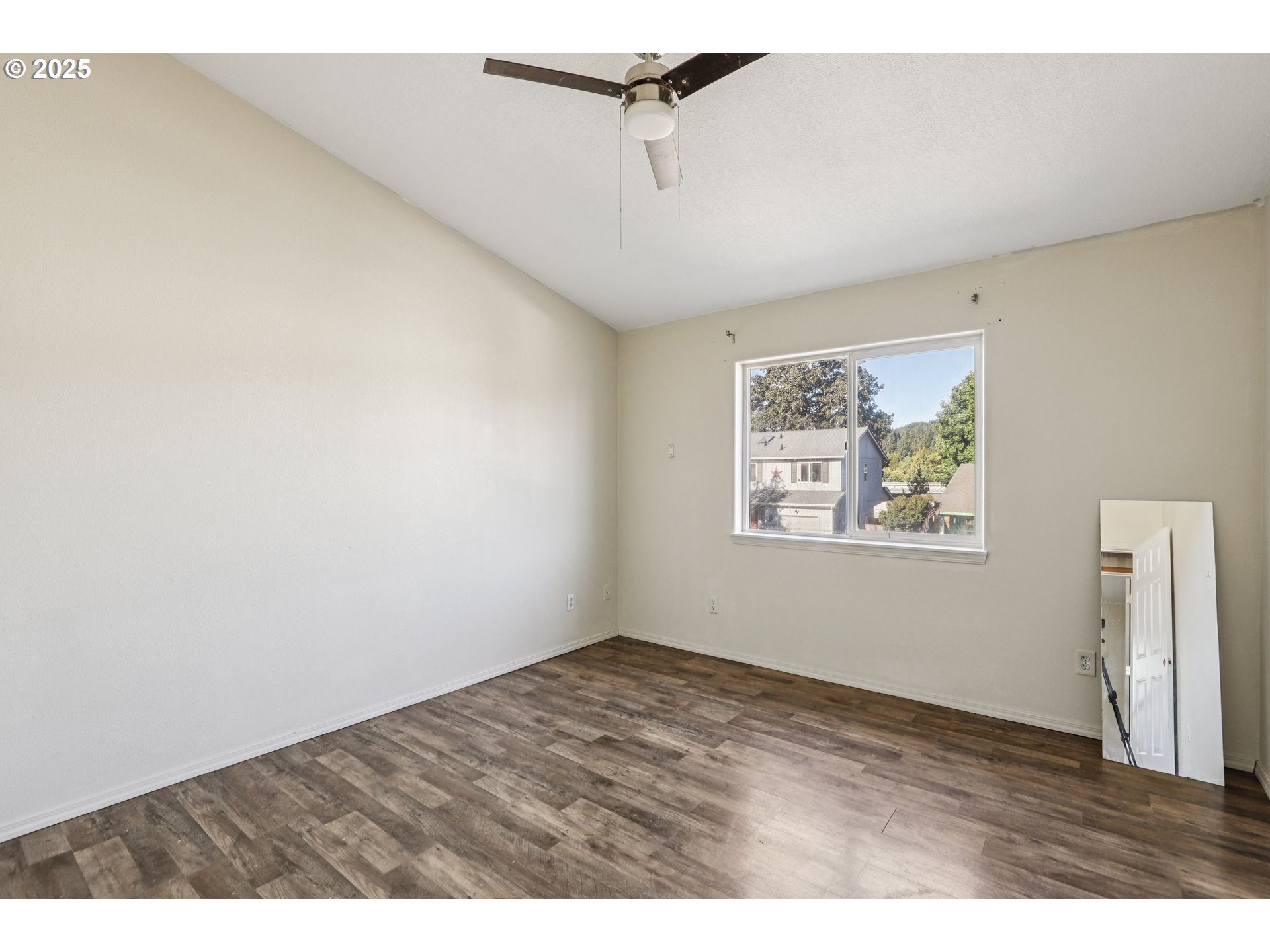 52866 Northeast 2nd Street Scappoose, OR 97056 - Photo 15 of 33 a view of an empty room with a window