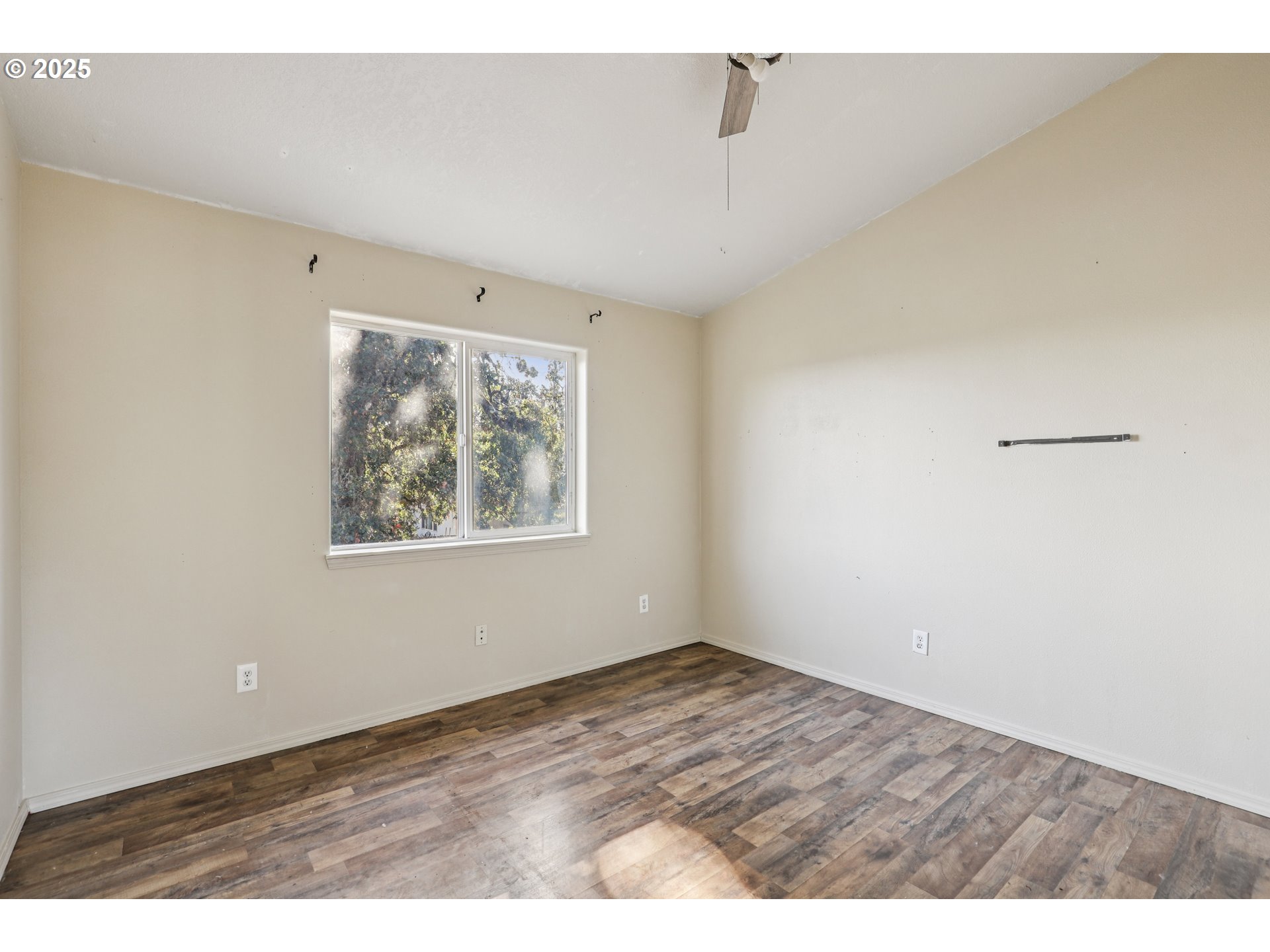 52866 Northeast 2nd Street Scappoose, OR 97056 - Photo 17 of 33 a view of an empty room with a window and closet