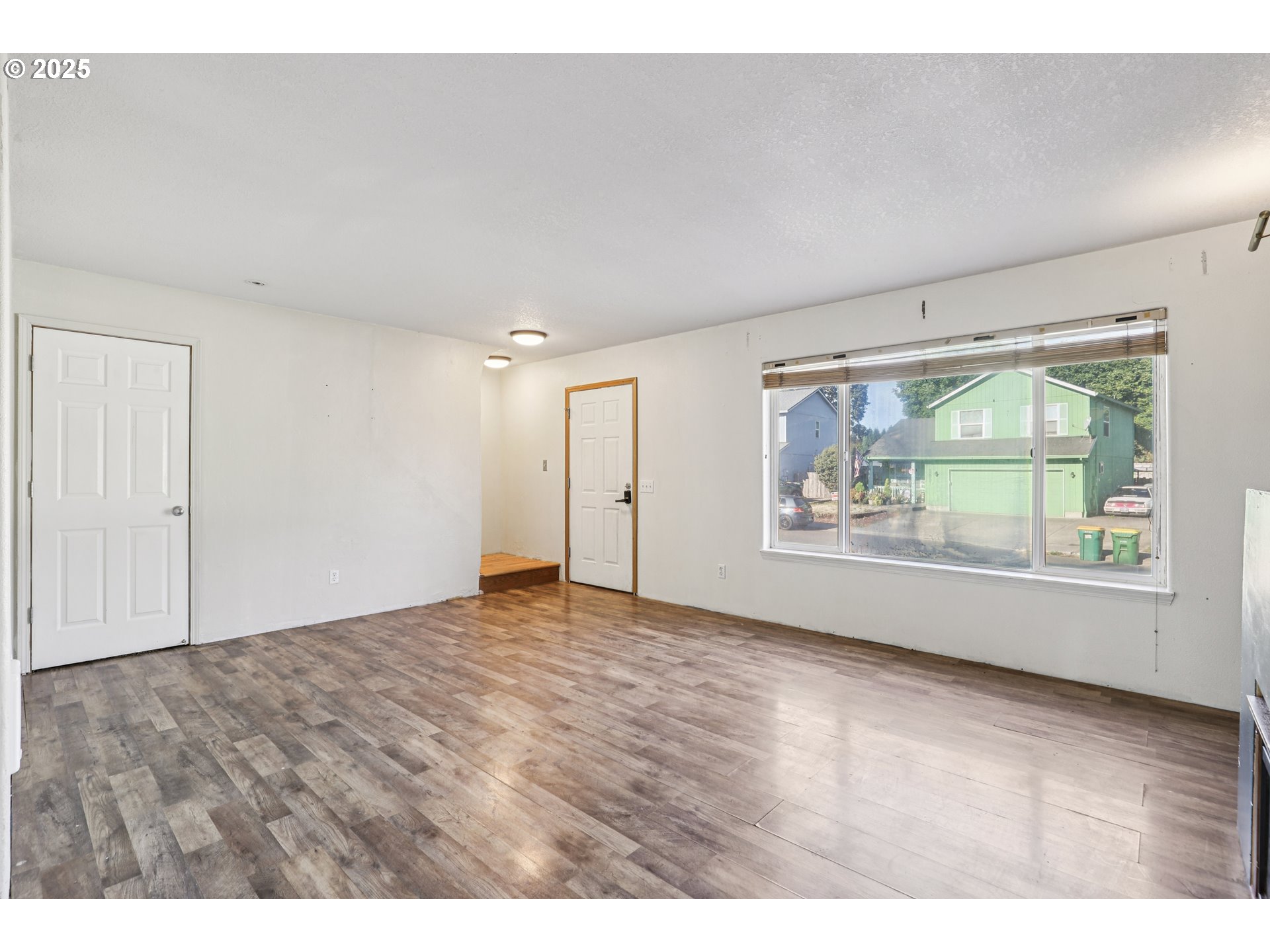 52866 Northeast 2nd Street Scappoose, OR 97056 - Photo 2 of 33 a view of an empty room with a window