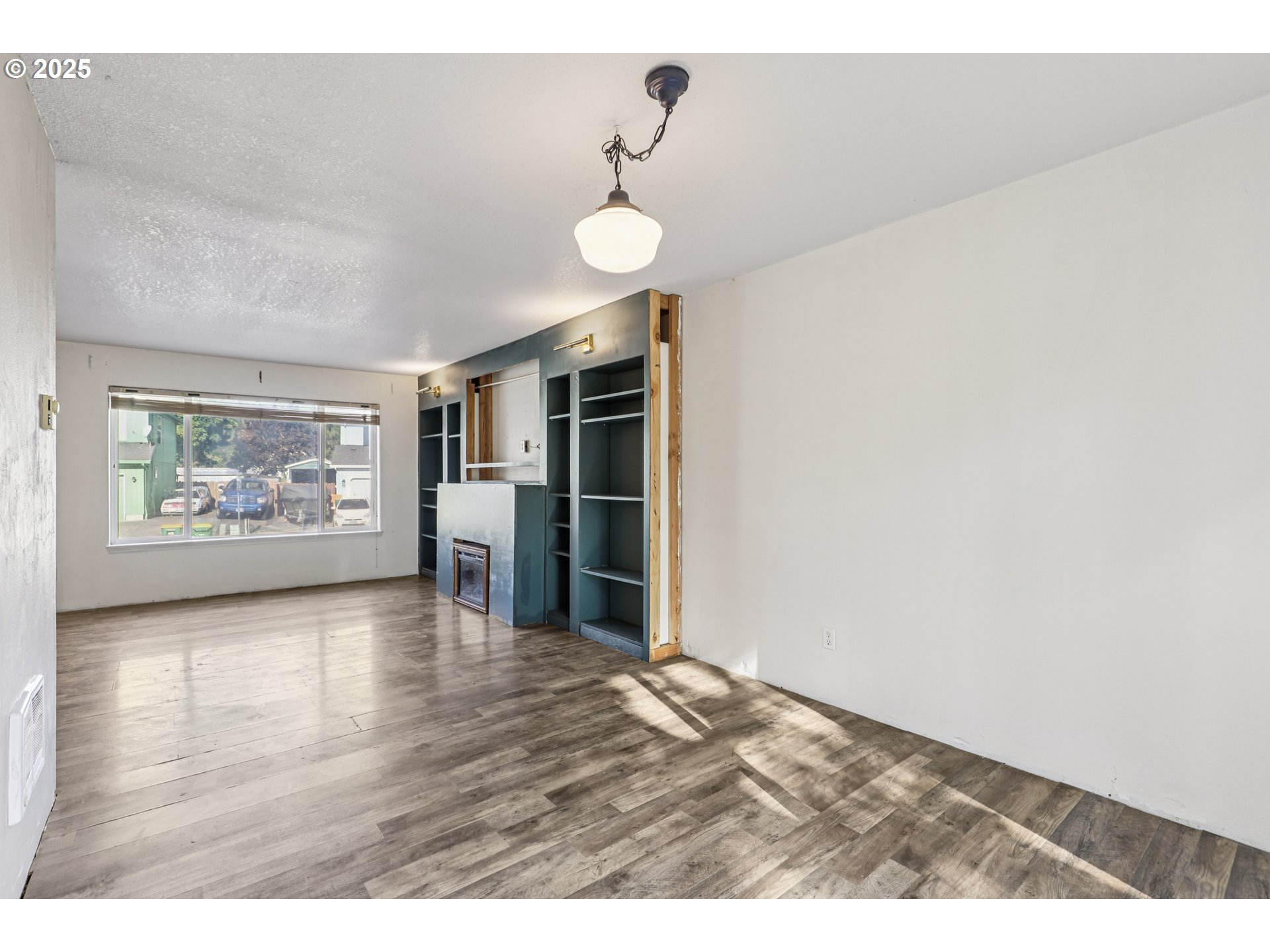 52866 Northeast 2nd Street Scappoose, OR 97056 - Photo 8 of 33 a view of a kitchen with furniture and wooden floor