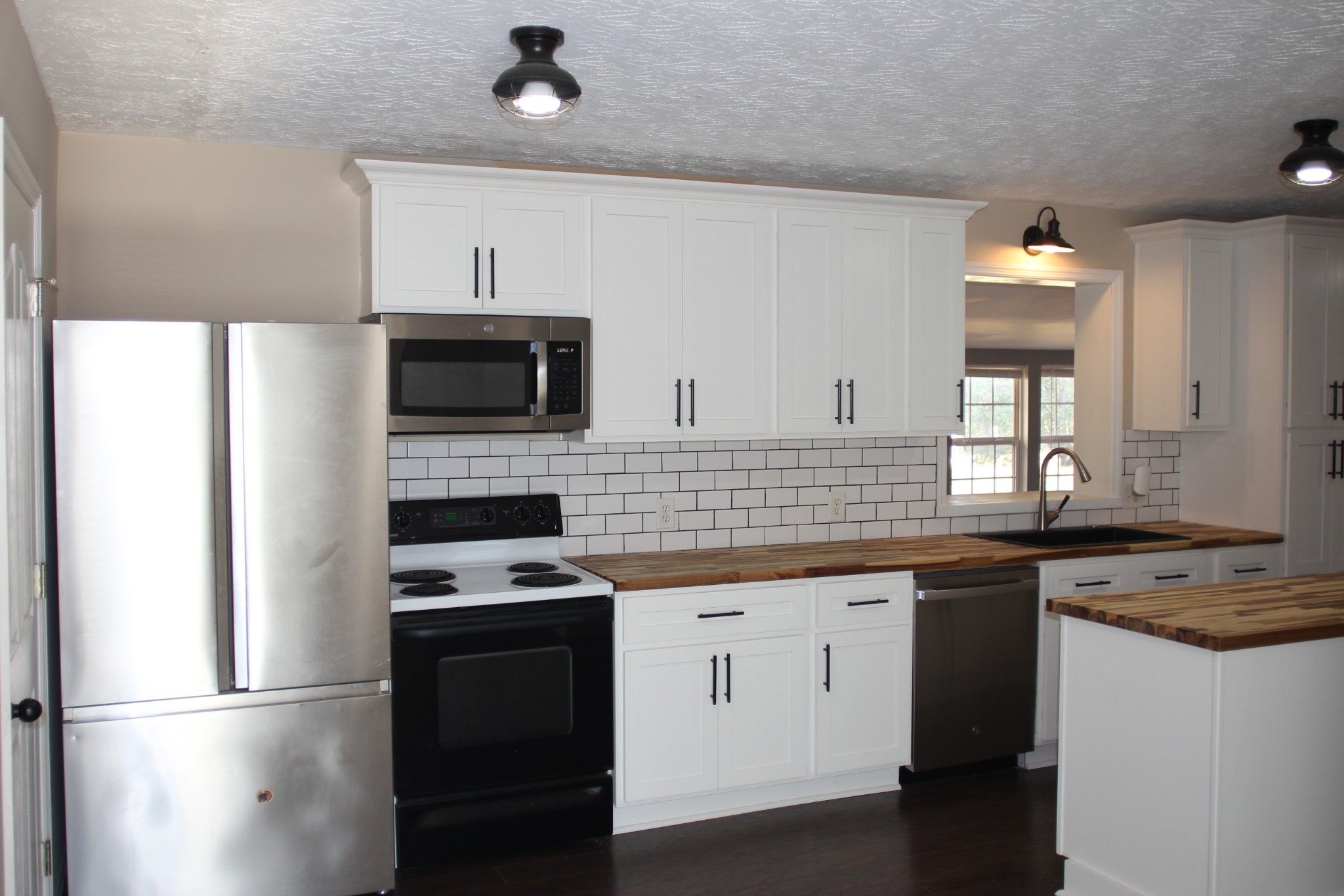 3847 Shellsford Road McMinnville, TN 37110 - Photo 5 of 20 a kitchen with a sink stove and microwave