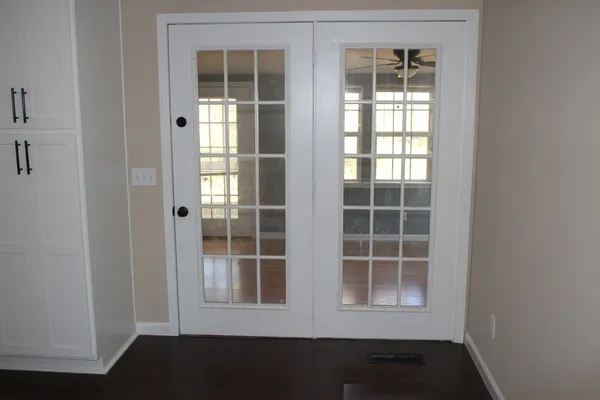 a view of empty room with windows
