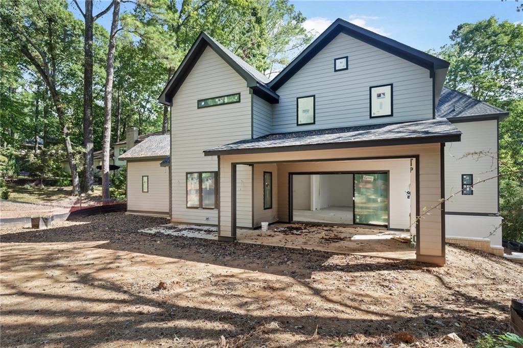 3886 Rains Court Northeast Brookhaven, GA 30319 - Photo 23 of 23 a front view of a house with a yard and garage