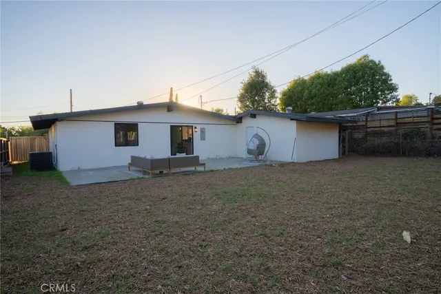 a house view with a backyard space