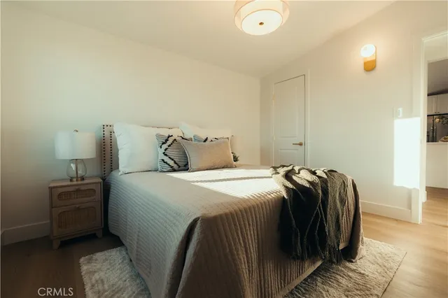 a bedroom with a bed and cabinets