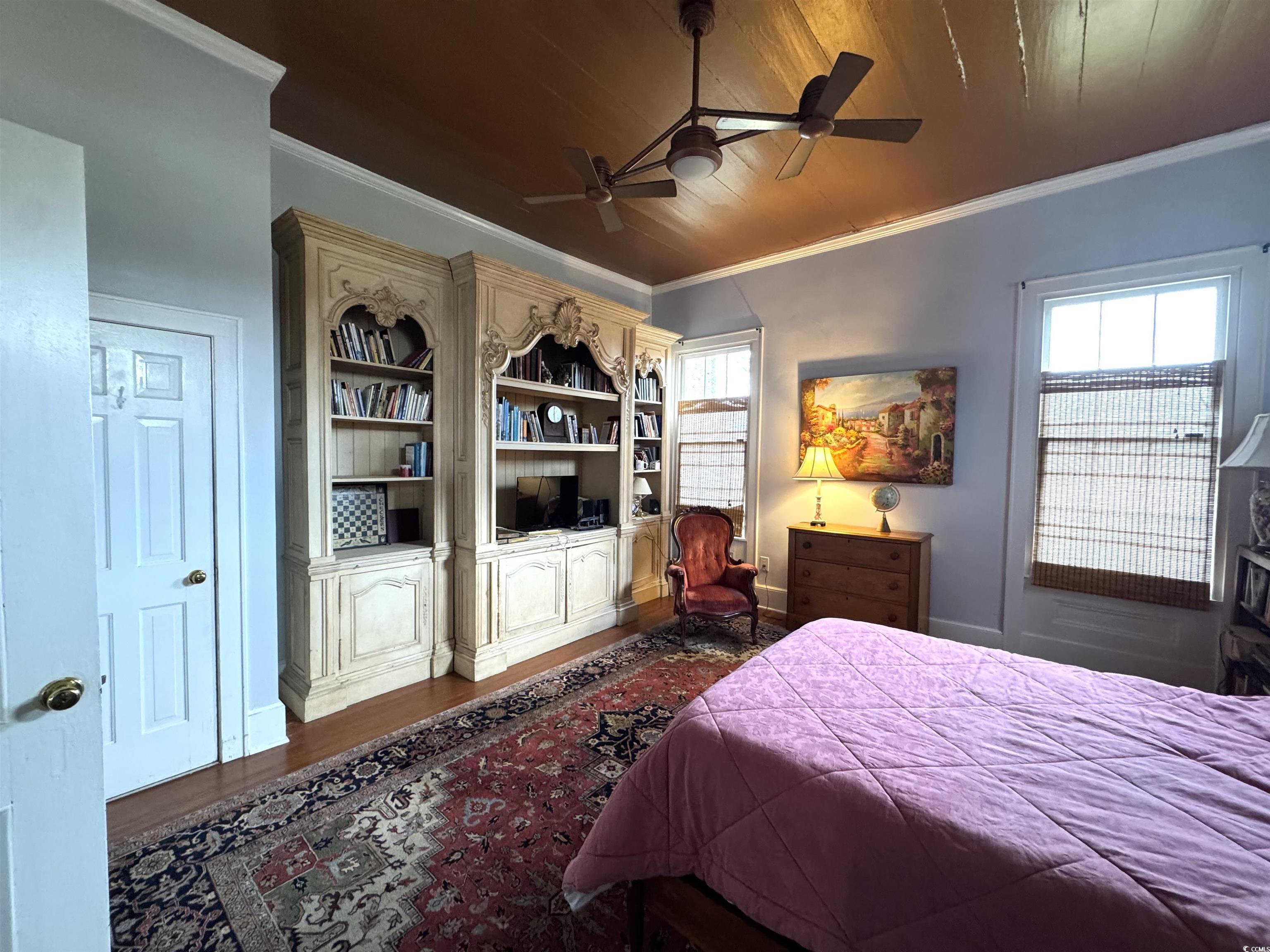 10463 County Line Road Hemingway, SC 29554 - Photo 11 of 40 Bedroom featuring wood ceiling, crown molding, dark wood finished floors, and ceiling fan
