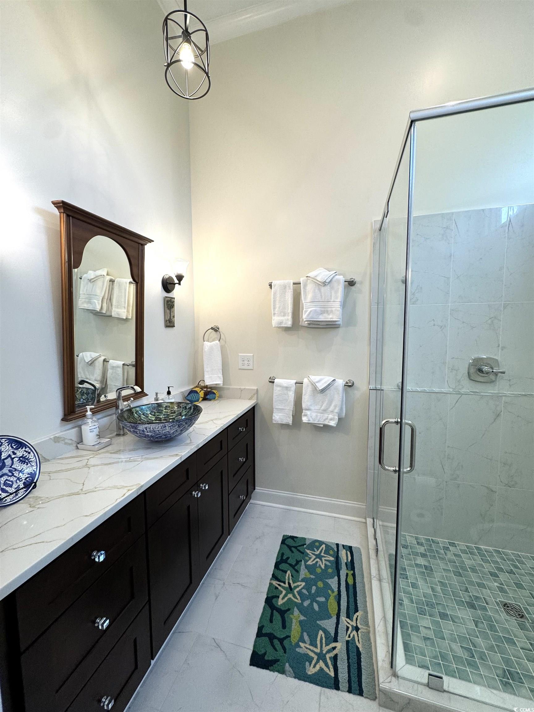 10463 County Line Road Hemingway, SC 29554 - Photo 23 of 40 Full bath featuring vanity, a shower stall, and light marble finish floors