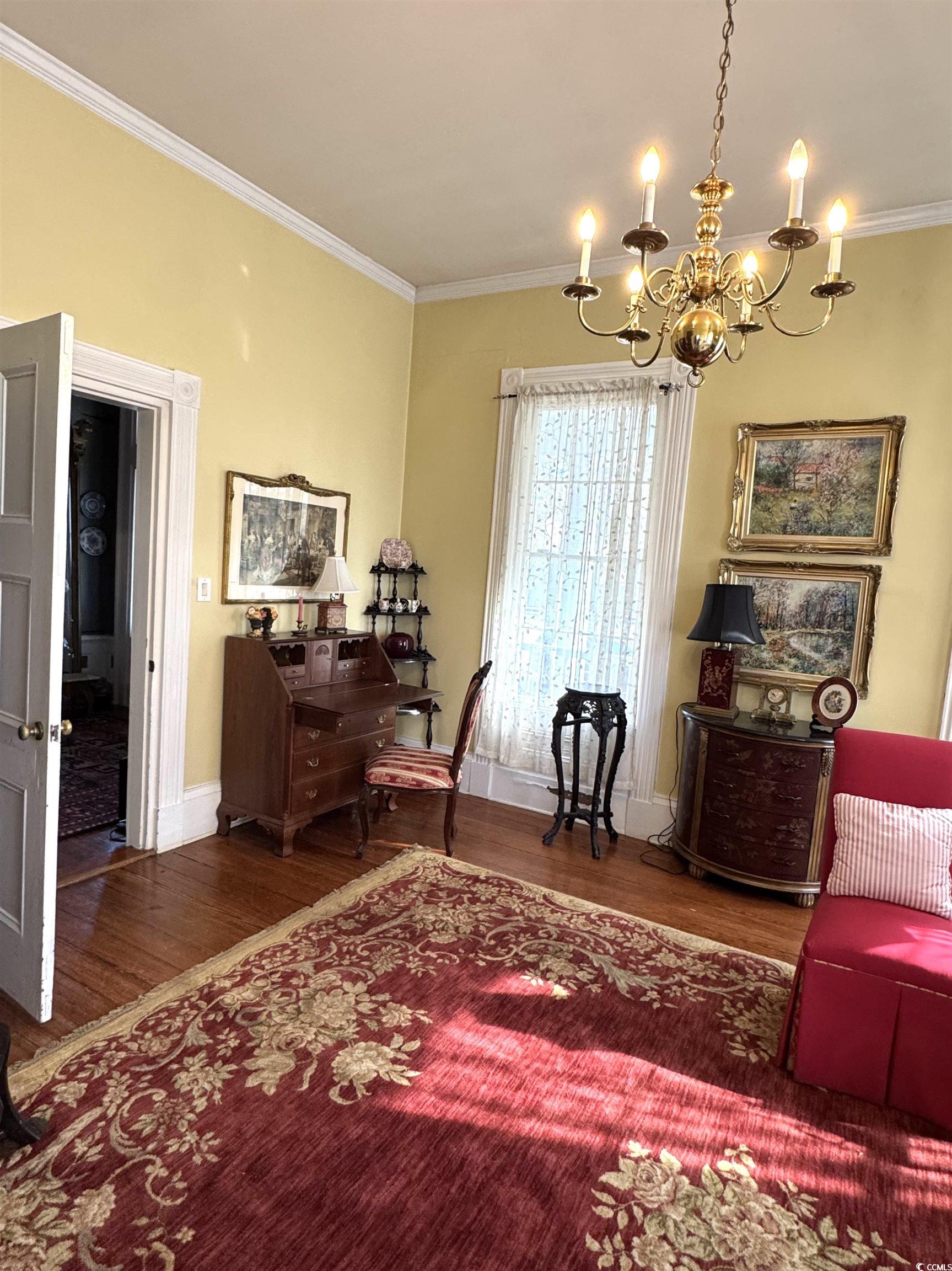 10463 County Line Road Hemingway, SC 29554 - Photo 7 of 40 Office with wood finished floors, a chandelier, and ornamental molding