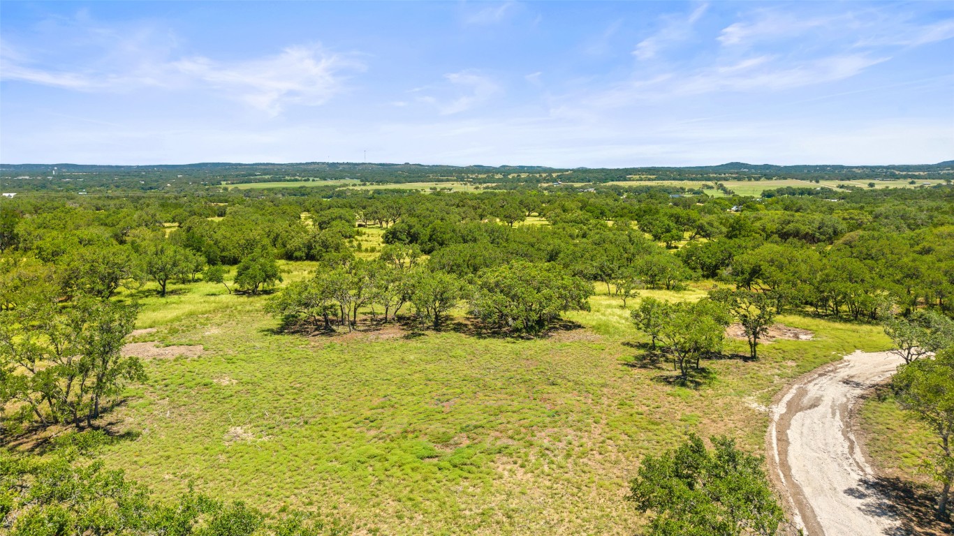 1094 Lindeman Lane Blanco, TX 78606 - Photo 7 of 11 a view of a lake with a house