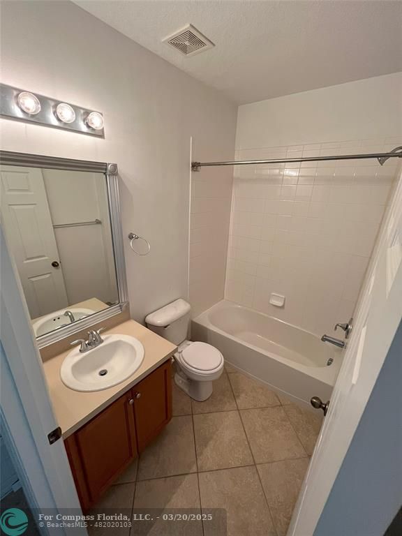9704 Windrift Circle Fort Pierce, FL 34945 - Photo 17 of 21 a bathroom with a sink a toilet and shower