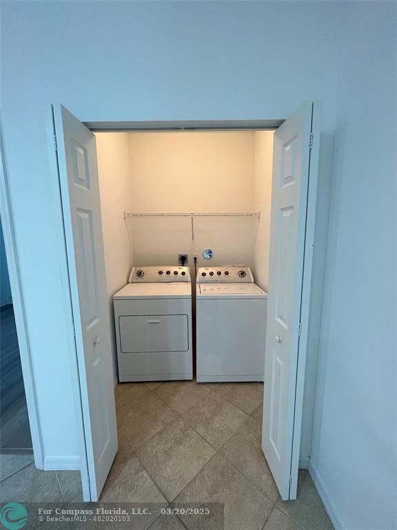 9704 Windrift Circle Fort Pierce, FL 34945 - Photo 18 of 21 a utility room with dryer and washer