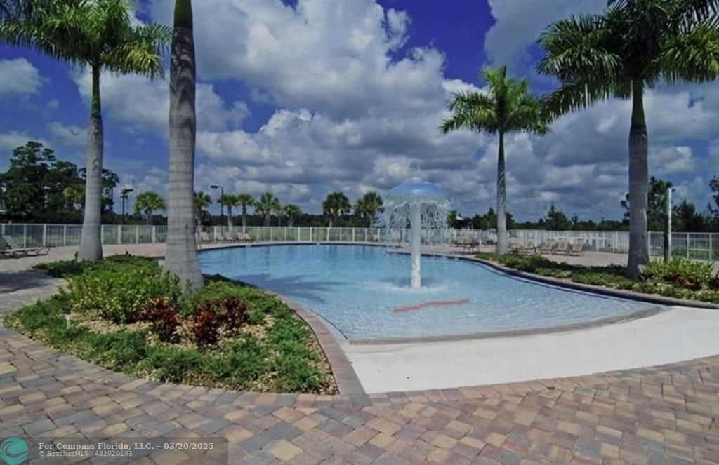 9704 Windrift Circle Fort Pierce, FL 34945 - Photo 20 of 21 a view of a yard with palm trees