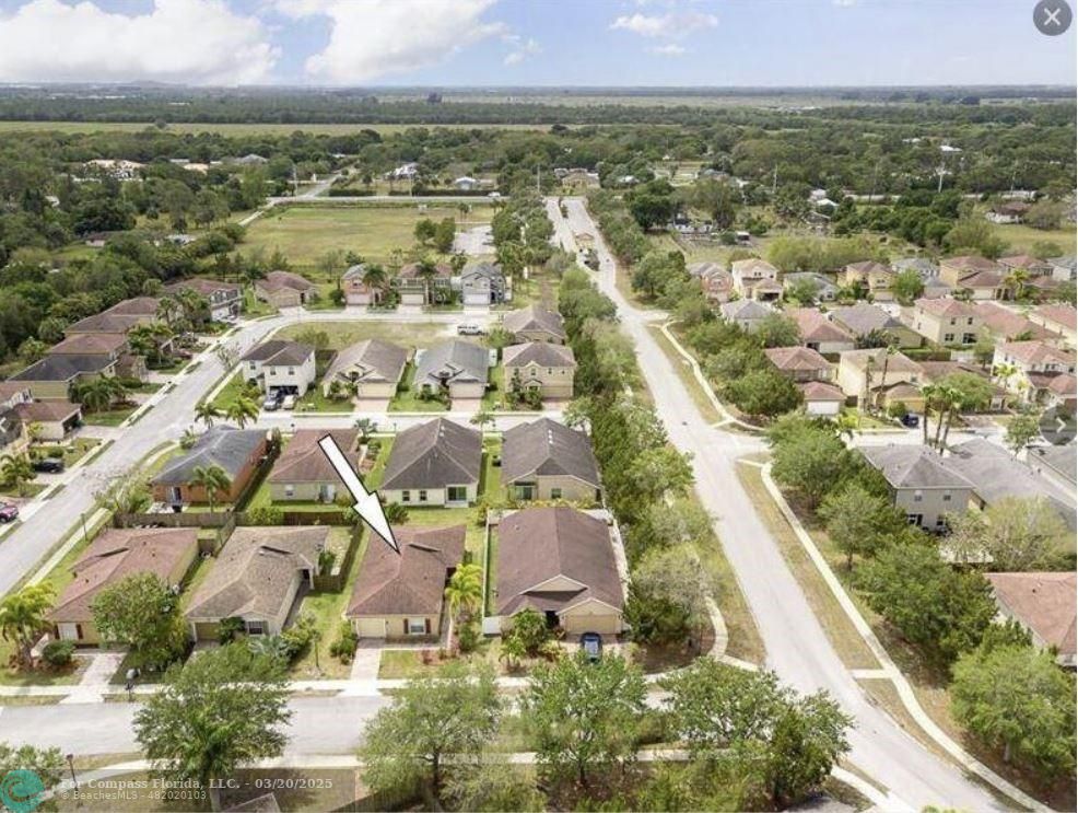 9704 Windrift Circle Fort Pierce, FL 34945 - Photo 3 of 21 an aerial view of residential building with outdoor space