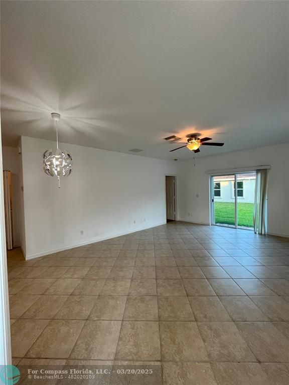9704 Windrift Circle Fort Pierce, FL 34945 - Photo 4 of 21 a view of an empty room with a window