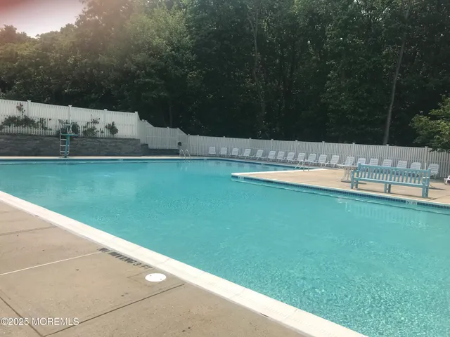a view of swimming pool with a yard