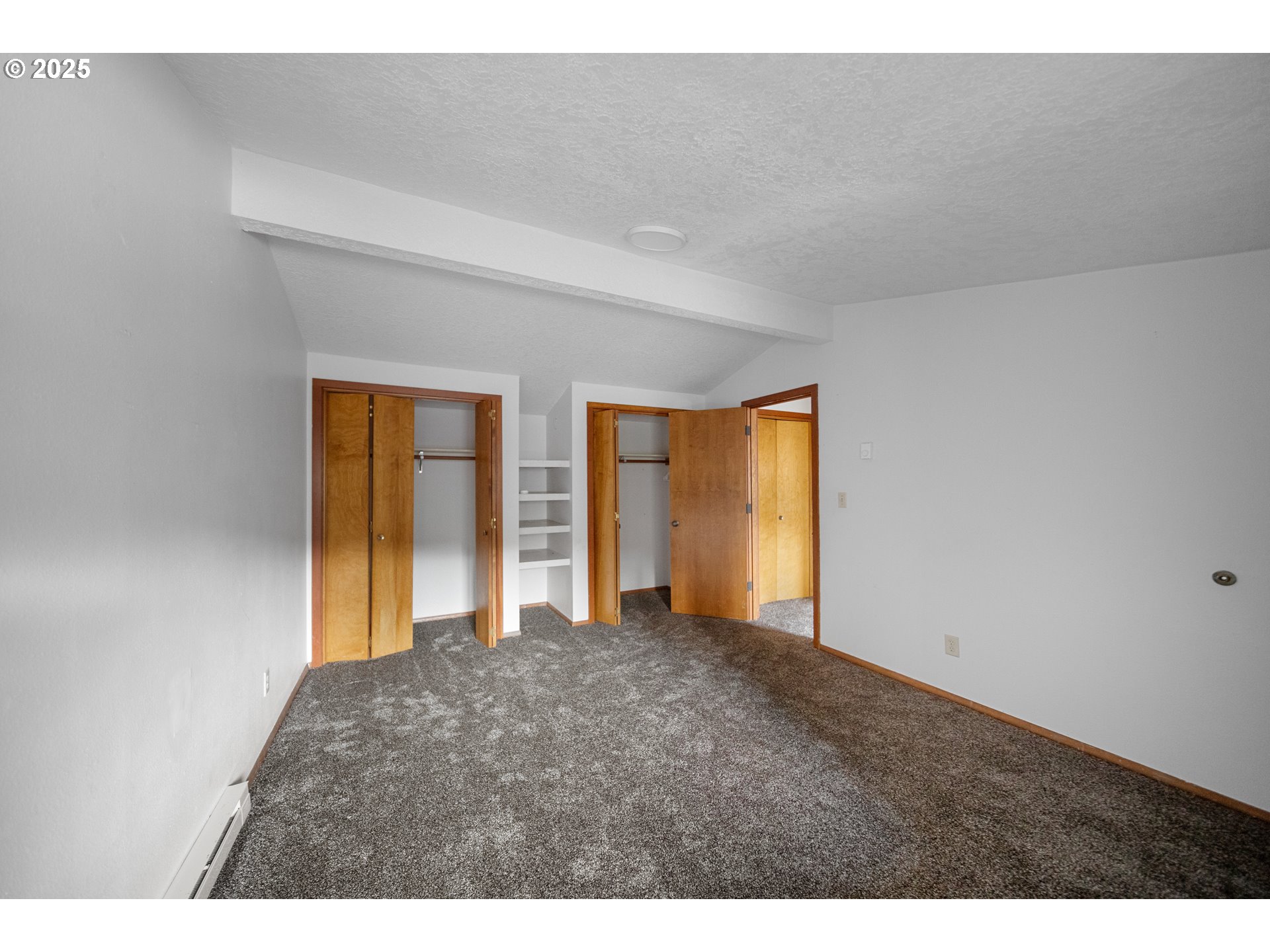604 Thorton Oar Lane Reedsport, OR 97467 - Photo 17 of 47 a view of an empty room with a window