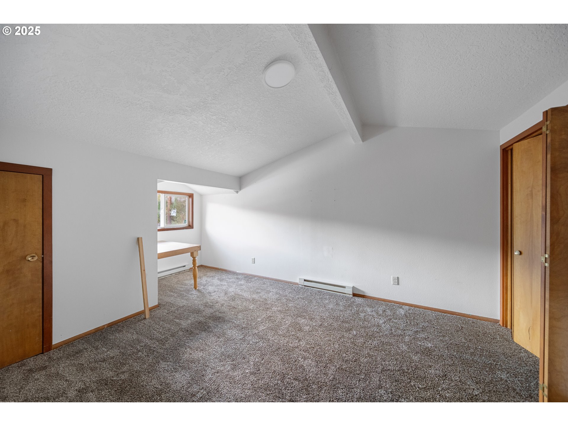 604 Thorton Oar Lane Reedsport, OR 97467 - Photo 18 of 47 a view of an empty room with a window