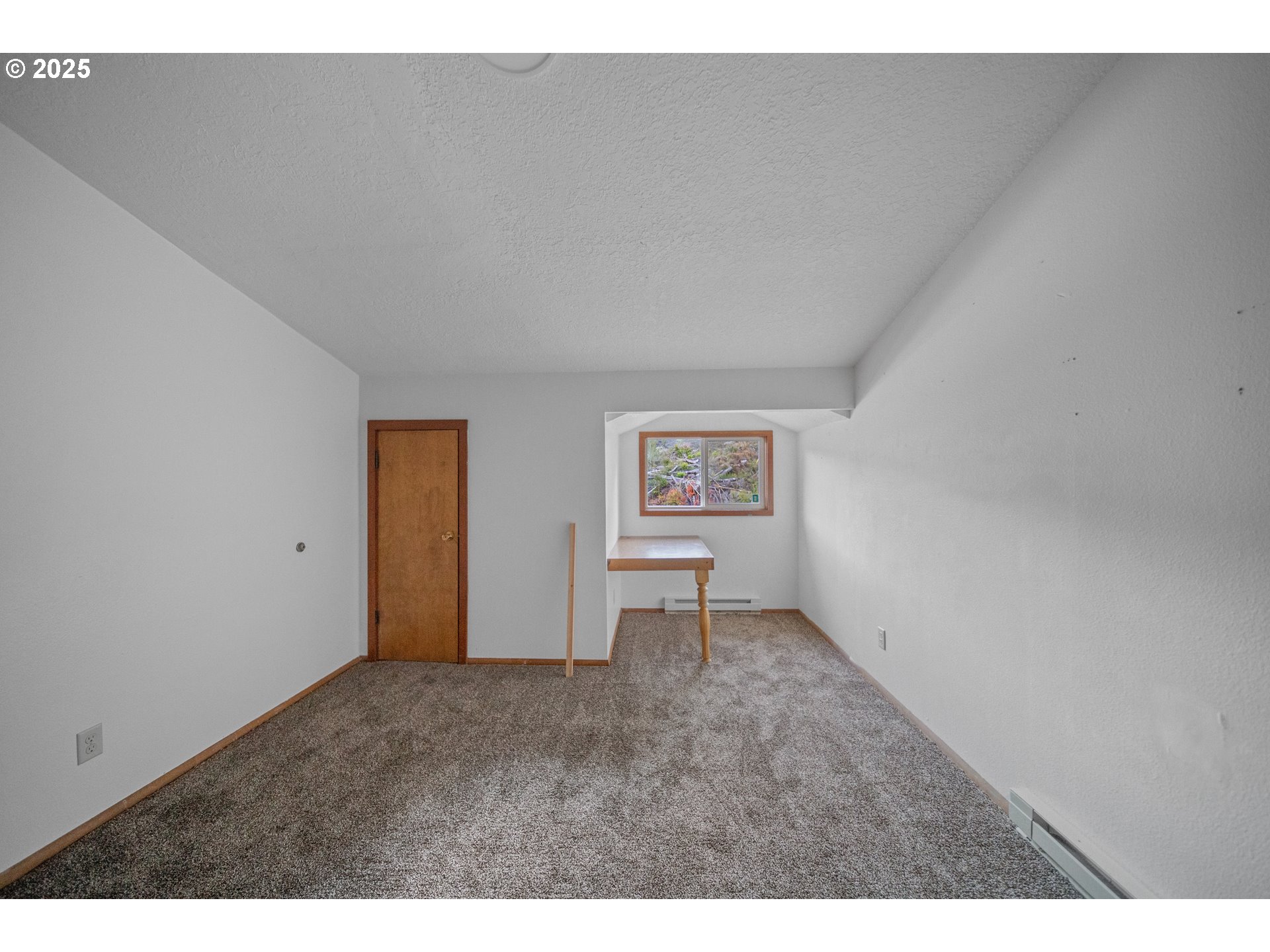 604 Thorton Oar Lane Reedsport, OR 97467 - Photo 19 of 47 a view of an empty room and a window