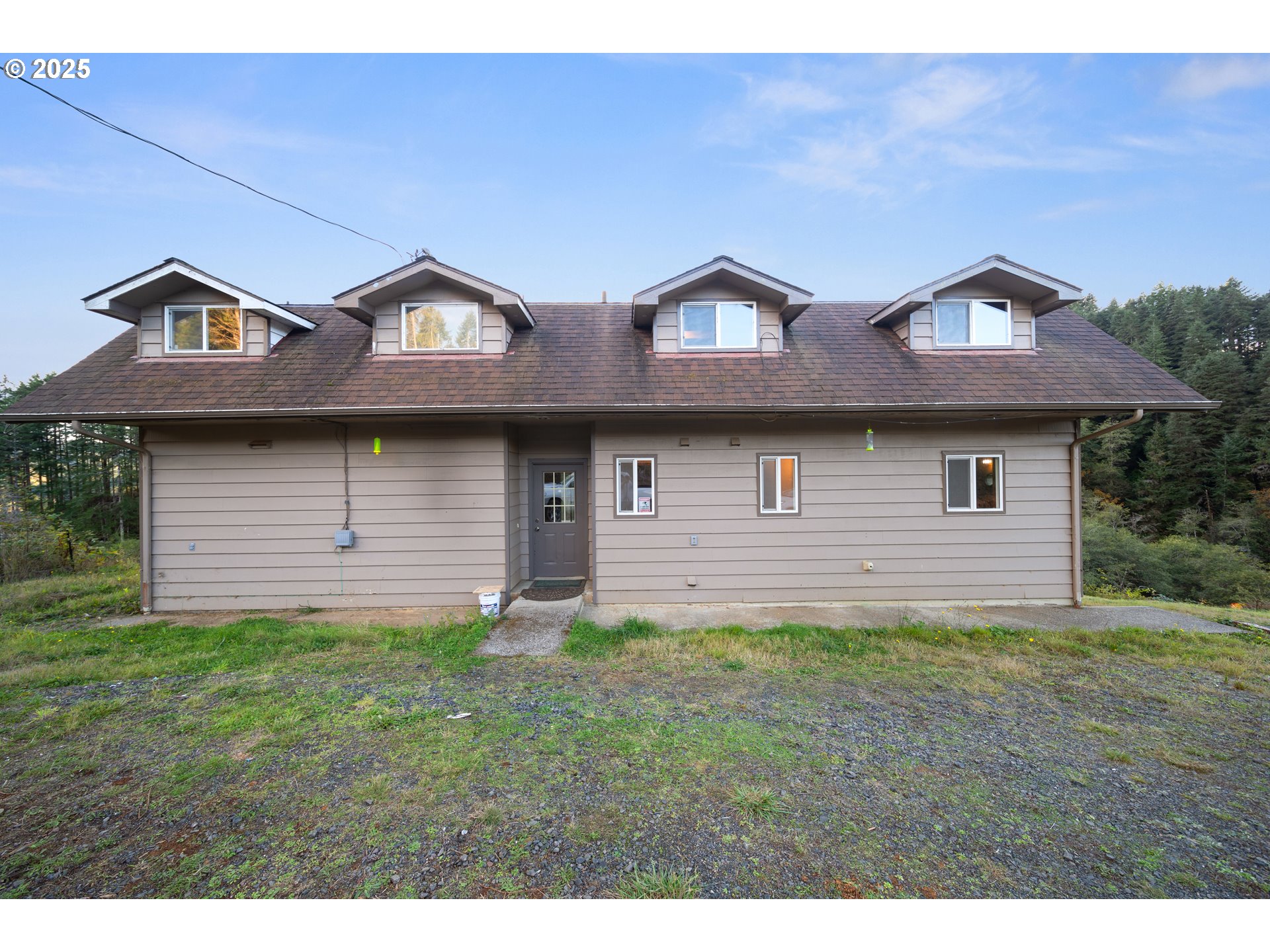 604 Thorton Oar Lane Reedsport, OR 97467 - Photo 2 of 47 a front view of a house with a yard