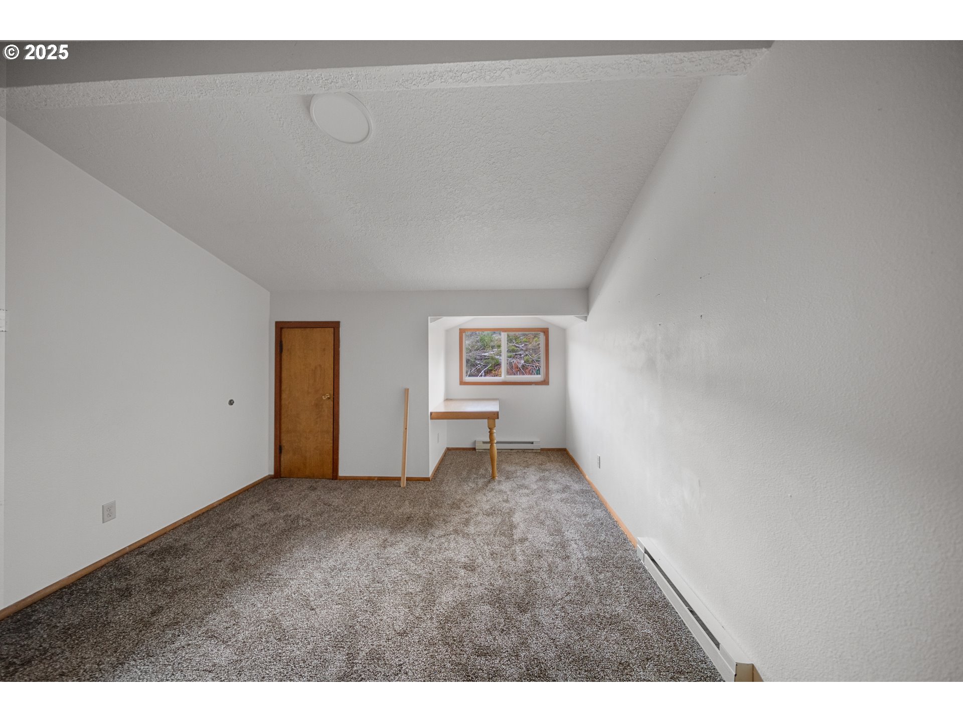 604 Thorton Oar Lane Reedsport, OR 97467 - Photo 23 of 47 a view of an empty room with a window