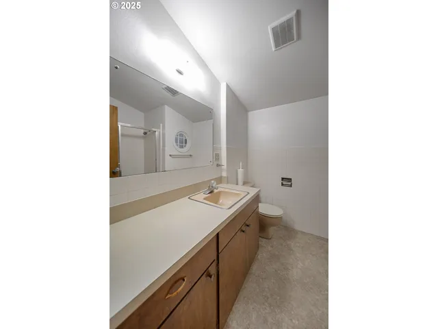 a picture of a bathroom with a sink