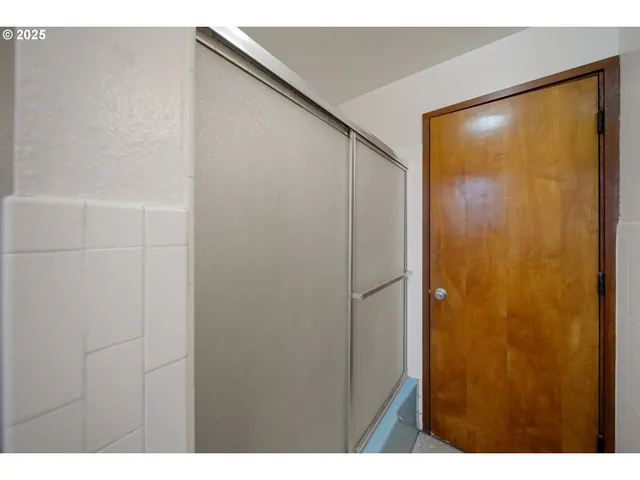 a bathroom with a sink and a shower