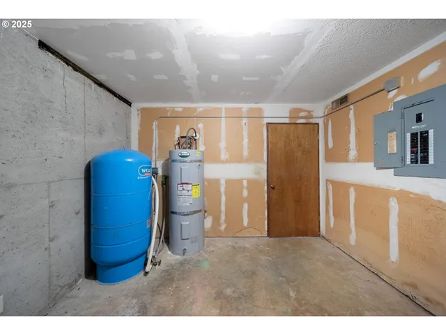 a bedroom with a bed and a table