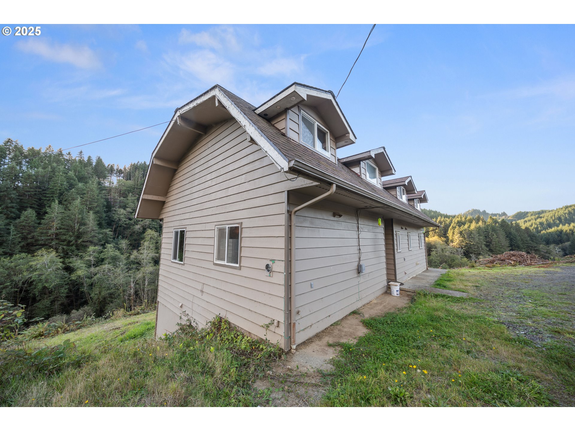 604 Thorton Oar Lane Reedsport, OR 97467 - Photo 40 of 47 a view of a small house with a yard